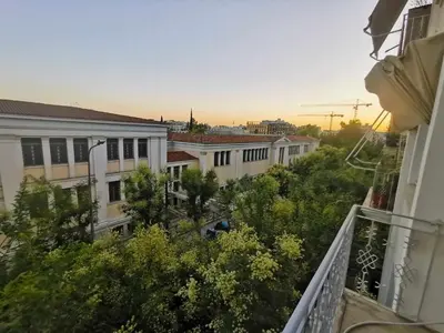 a view from a balcony of buildings and trees at Odel in Athens