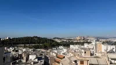 an aerial view of a city with buildings at Loft Pagrati in Athens