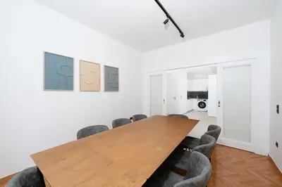 a conference room with a wooden table and chairs at Kolonaki Elegant Apartment with Balcony in Athens