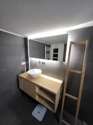 a bathroom with a sink and a mirror at Painters apartment in Athens