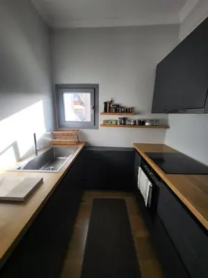 a kitchen with a sink and a counter top at Painters apartment in Athens