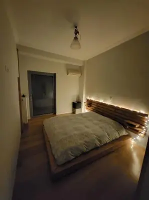 a bedroom with a large bed in a room at Painters apartment in Athens
