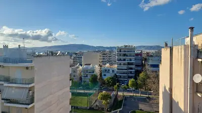 a view of a city with buildings and mountains at THEA Terrace 6th floor Apartment in Athens