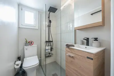 a bathroom with a toilet and a sink and a shower at THEA Terrace 6th floor Apartment in Athens