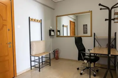 a room with a mirror and a desk and a chair at Quiet and cozy apartment next to Acropolis in Athens