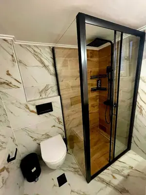 a bathroom with a toilet and a shower at Luxury 2BR Ellinikon Apartment Oasis - Athens Riviera in Athens