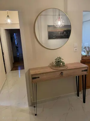 a mirror and a table in a room at Luxury 2BR Ellinikon Apartment Oasis - Athens Riviera in Athens