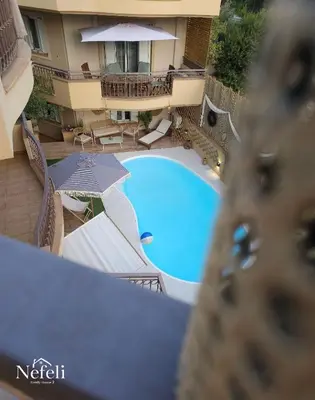 an overhead view of a swimming pool in a hotel at Nefeli Villa lagonisi - Pool in Lagonissi