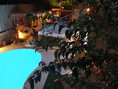 a view of a patio at night at Nefeli Villa lagonisi - Pool in Lagonissi