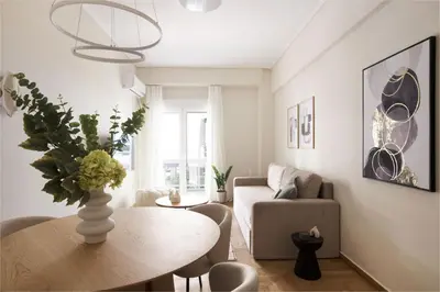 a living room with a table and a couch at Athens Heart Stay 1BR Apartment in Koukaki by UPSTREET in Athens
