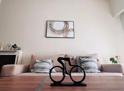 a black chair in a living room with a couch at Concert Hall Apartment - Semitelou in Athens