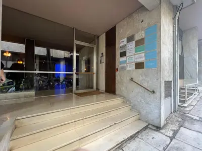 a building with stairs in front of a building at Concert Hall Apartment - Semitelou in Athens