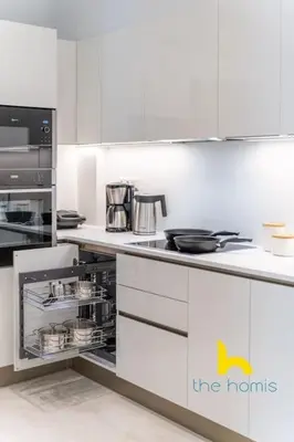 a kitchen with white counters and a stove top oven at Upscale central APT, Patio near Hospitals & Metro in Athens