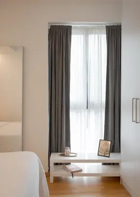 a bedroom with a white bed and a window at Orpheas Athens Comfy Apartment in Athens