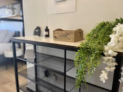 a table with a sign that says home on it at Cosy studio in Pagrati Caravel, 4th floor in Athens