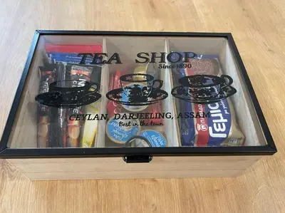 a box of tea shop items on a table at Zografou City Studio in Athens