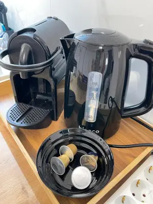 a coffee maker sitting on a counter with a basket at Zografou City Studio in Athens