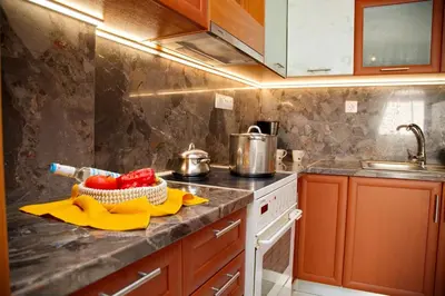 a kitchen counter with a bowl of fruit on it at Aroura Home 2BR Neos Kosmos in Athens