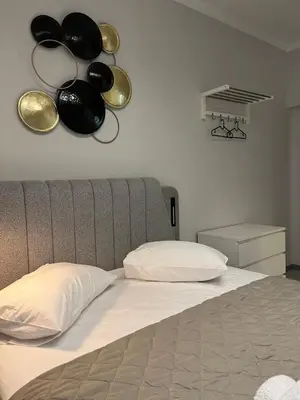 a bedroom with a bed with pots and pans on the wall at Aura Suite by Zeussuites in Athens