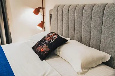 a pillow sitting on top of a bed at Aura Suite by Zeussuites in Athens