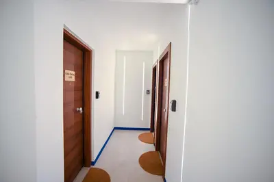 an empty hallway with two doors and a hallwayngth at Plaka Central Suite by Zeussuites in Athens