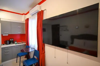 a kitchen with a large window and a table and chairs at Plaka Central Suite by Zeussuites in Athens