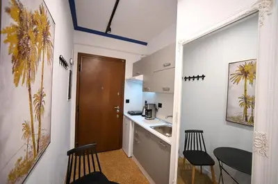 a small kitchen with a sink and a table at Monastiraki Suite by Zeussuites in Athens