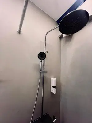 a shower head in a bathroom with at Monastiraki Suite by Zeussuites in Athens