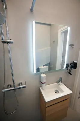 a bathroom with a sink and a mirror at Athinaidos Suite by Zeussuites in Athens