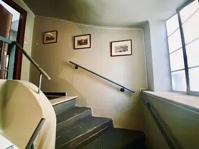 a staircase in a building with a window at Sophia Urban lux in Athens