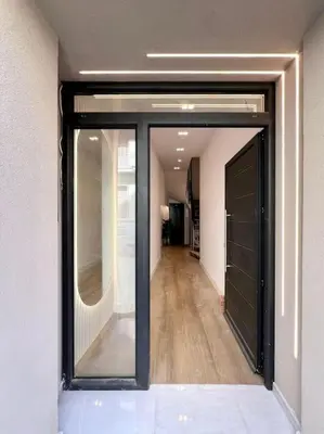 a hallway with sliding glass doors in a building at BlueMotion - CityView in Piraeus