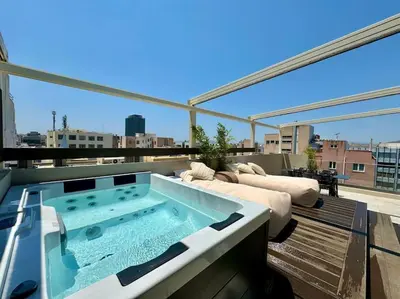 a hot tub sitting on top of a roof at BlueMotion - CityView in Piraeus