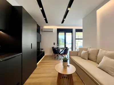 a living room with a couch and a table at BlueMotion - PortSuite 4B in Piraeus