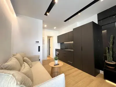 a living room with a couch and a table at BlueMotion - PortSuite 4B in Piraeus