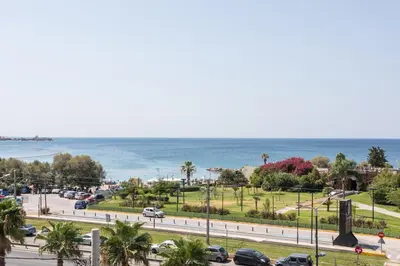 a view of a city with the ocean in the background at Alimos 2BR Apartment with Splendid Sea View by UPSTREET in Athens