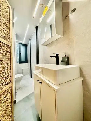 a bathroom with a white sink and a toilet at Sophia Luxury Loft in Athens