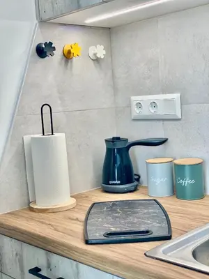 a kitchen counter with a coffee pot and cups on it at Sophia Luxury Loft in Athens