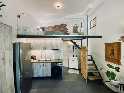 a small kitchen with a sink and a refrigerator at Sophia Luxury Loft in Athens