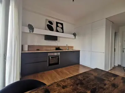 a kitchen with white walls and a sink and a stove at CDV stylish Athens flat in Athens