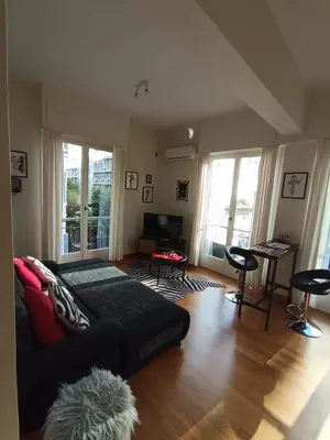 a living room with a couch and a table at CDV stylish Athens flat in Athens