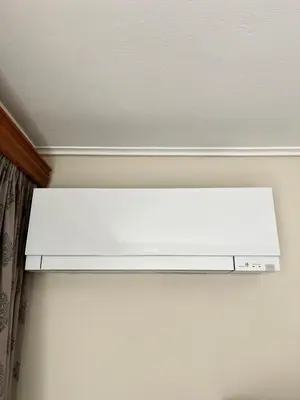 a white light hanging from a ceiling in a room at Mamour Apartments, Near Tram & 8' to Beach, Queen Bed Comfort in Athens