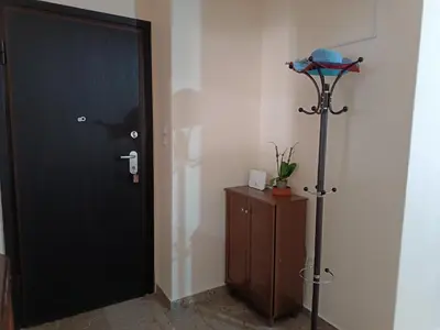 a room with a black door and a wooden cabinet at ALΚO central PARK ATHENS in Athens