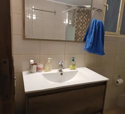 a bathroom with a white sink and a mirror at ALΚO central PARK ATHENS in Athens