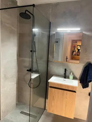 a bathroom with a shower and a sink and a shower at Cozy quiet studio near the sea in Athens