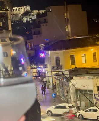 a view of a city street at night with cars at GRACE Apartment Next to the Akropolis in Athens