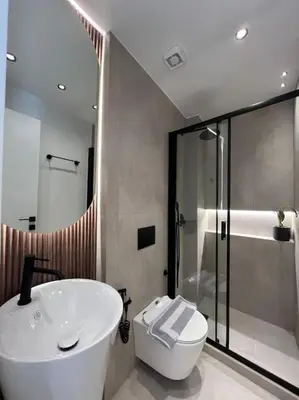 a bathroom with a sink and a toilet and a shower at BlueMotion - PortSuite 5A in Piraeus