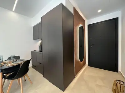 a room with a table and a black partition at BlueMotion - PortSuite 5A in Piraeus