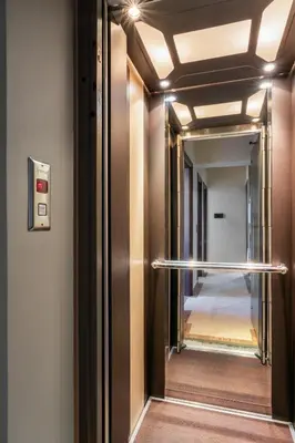 a hallway with a large mirror and a hallway at Indoor pool villa, near the beach, Lagonisi in Kalívia Thorikoú