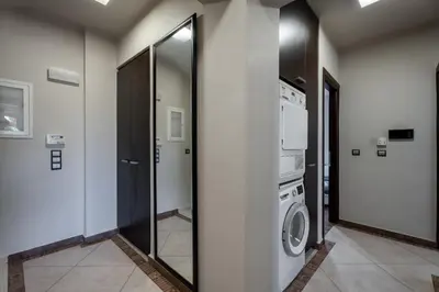 a laundry room with a washer and dryer at Indoor pool villa, near the beach, Lagonisi in Kalívia Thorikoú