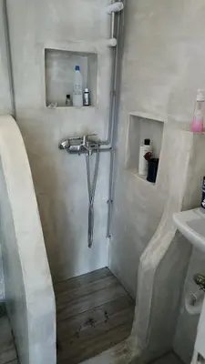 a shower in a bathroom with a sink at Penth3 in Athens